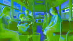 Amir and his grandmother watch a street musician playing guitar on a bus.