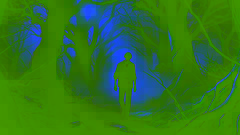 Fletcher walking through a dark, misty forest with thick trees and a tense expression on his face.