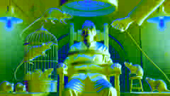 Winston strapped to a chair in Room 101, with a cage of rats being brought close to his face.