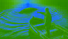 A startled fisherman points toward a long, undulating shape breaking the water’s surface near his boat.