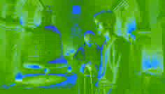 Mateo Rojas and Father Esteban stand in a dim crypt, gazing at the ancient Silver Bell adorned with glowing carvings.