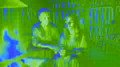 Marisol sits by the fire with her grandmother, sharing her worries after meeting Yacy Yateré.