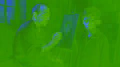 Bragolin painting a sorrowful child in his dimly lit art studio