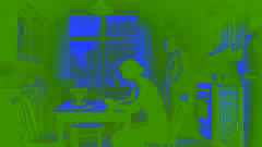 Couple sitting in their dimly lit kitchen, mother looking at mail, father staring out the window.