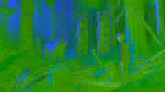 Aiden watches Yetsa, the Spirit Bear, standing in front of an ancient totem pole in the mystical forest clearing.