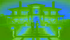 Cinder and Jordan standing united on the steps of the mansion during a candlelit event.