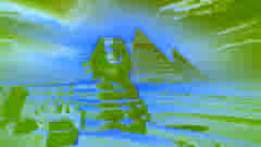 The Great Sphinx of Giza stands before the pyramids, with a desert sunset casting vibrant hues over the landscape.