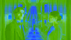 Jordan Glass and Cinder share a subtle, intense gaze in an ornate mansion corridor.