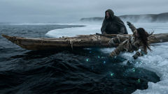 Sedna falling into an Arctic bay as her father stands ashamed on the shoreline