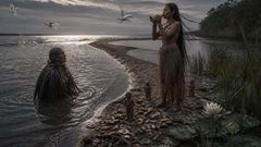 On the tide-born sand, she chose broken clay over easy victory, and the east began to open.