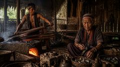 Heat, metal, and memory gathered in the hut before the second darkening.
