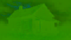 Ancient farmhouse under stormy skies surrounded by wild grasses